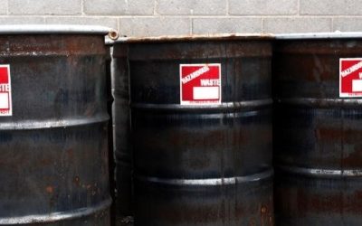 Black hazardous waste barrells