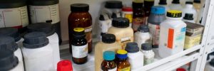 Bottles of chemicals in lab cabinet