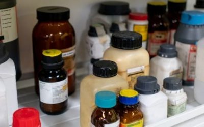 Bottles of chemicals in lab cabinet