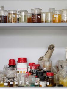Lab samples and chemicals on shelf