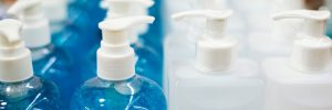 Bottles of blue and white hand sanitizer